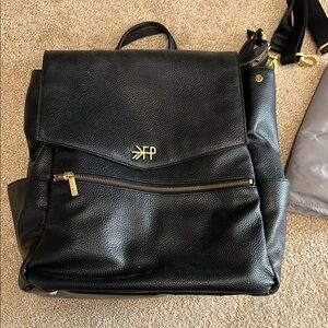 Stylish Black Leather Backpack with Flap Closure and Adjustable Straps